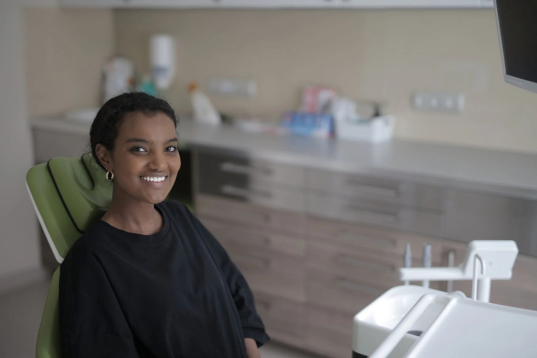 Smiling dental patient; representative photo